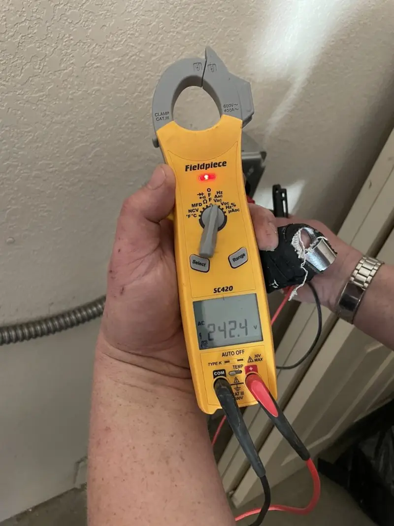 Voltage testing with clamp meter during Whole House Surge Protector in Struthers